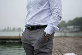 Man wearing grey pants with a striped shirt for a formal or business-casual outfit idea