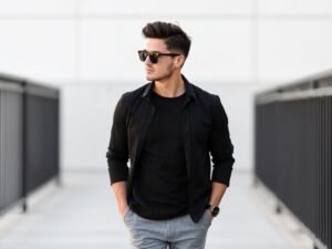 Man wearing grey pants with a black shirt for a sharp and attractive appearance