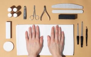 Close-up of matte black nails with care and maintenance tools