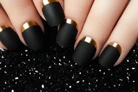 Matte black nail polish with elegant nail art design