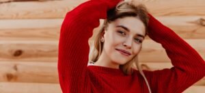 Red sweater dress styled with various neckline accessories like scarves, necklaces, and inner layers.