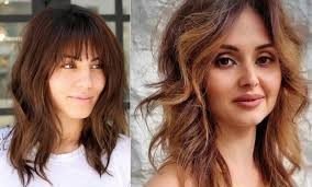 Woman with wolf cut hairstyle featuring layered texture and volume